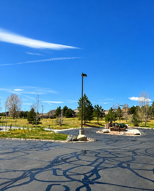 Residential community roadway protected with professional asphalt maintenance services by Prime Line Company